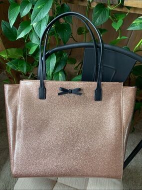 kate spade rose gold glitter tote with black handles and bow